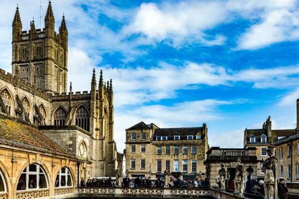 Antique historic landmark Roman Baths and Bath Abbey in Bath England UK