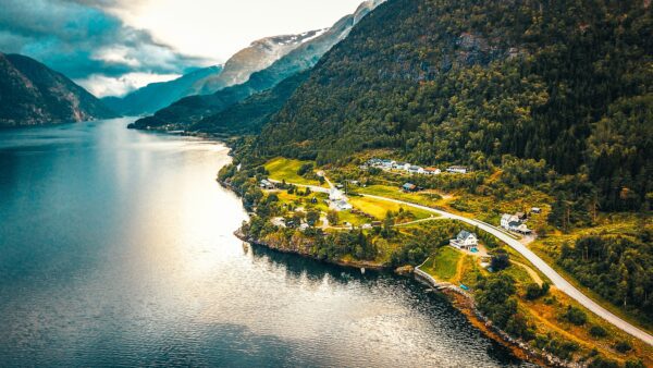 high contrast beautiful landscape of norway road next to mountains and sea