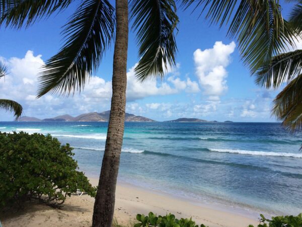 expansive view of ocean from beach in bvi with islands in view