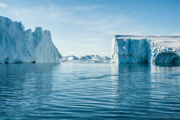 massive icebergs emerged out of the arctic waters of greenland at Ilulissat Icefjord