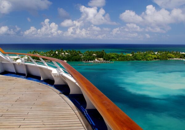 a deck level of a cruise ship overlooking blue ocean near Nassau Bahamas