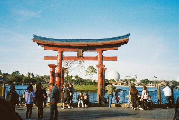 archway in asia near water with tourists surrounding it