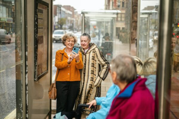 four older travelers taking pictures