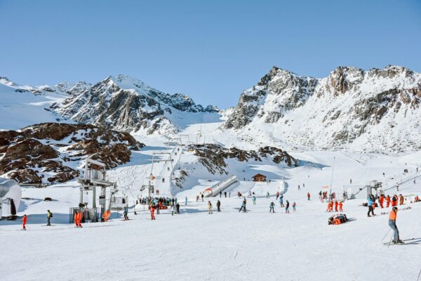 skiers on a snowy mountain at a ski resort