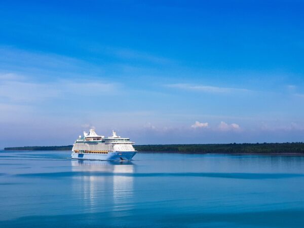 large cruise ship sailing Malaysian blue waters with open sky