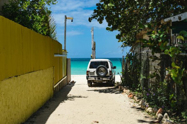 vehicle parked up next to beach in Jamaica