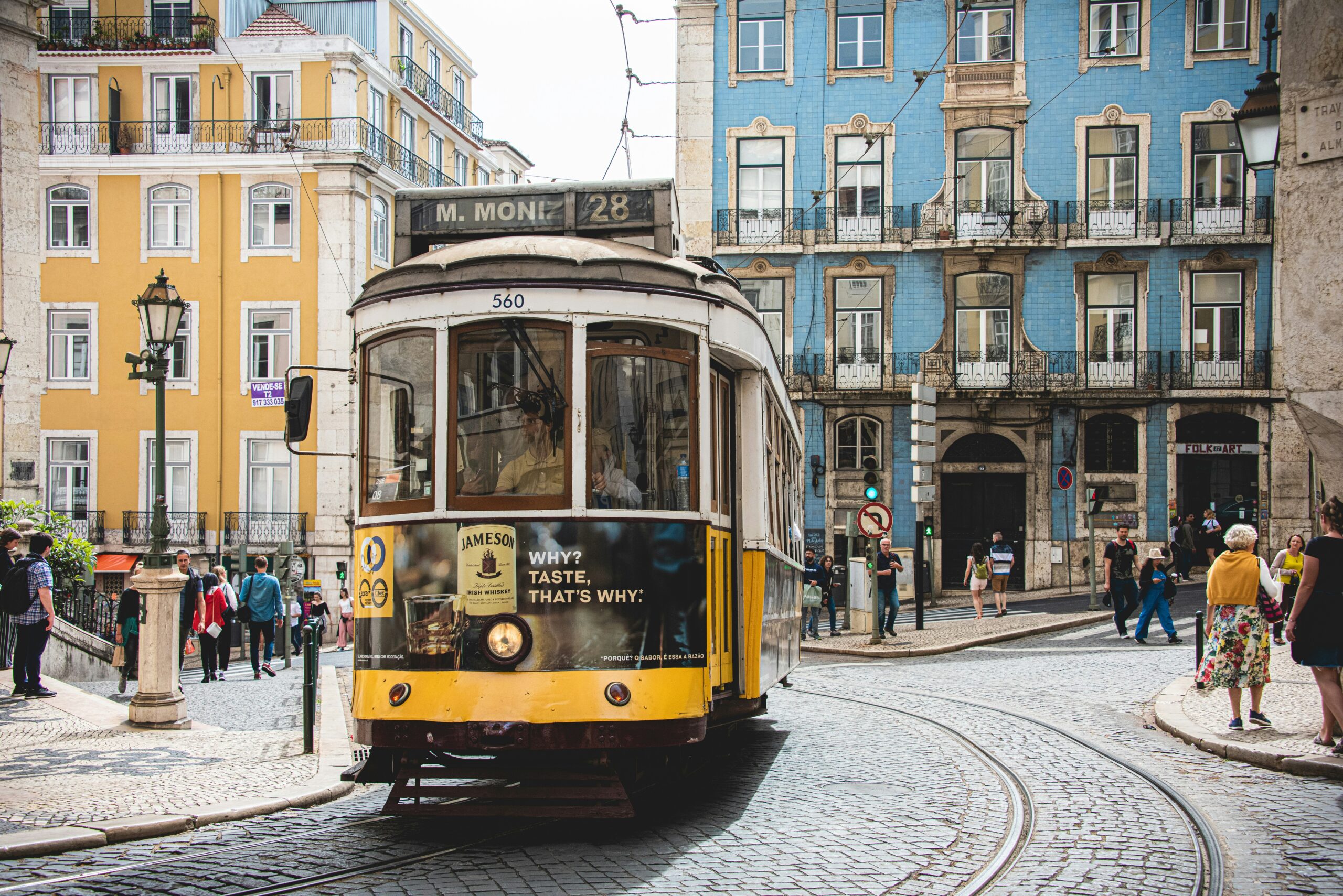 train car in Portugal with beautiful buildings in background